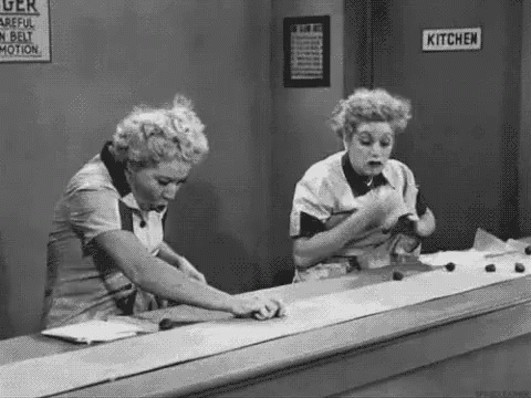 Animated gif of Lucy and Ethel from "I Love Lucy" frantically trying to keep up with chocolates on a runaway conveyor belt